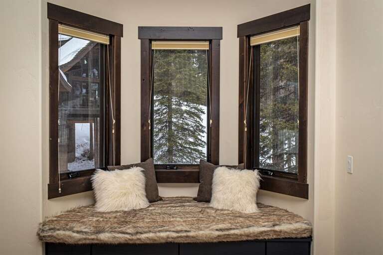 Get cozy and take in the views from the fur-lined window seat | Main Level