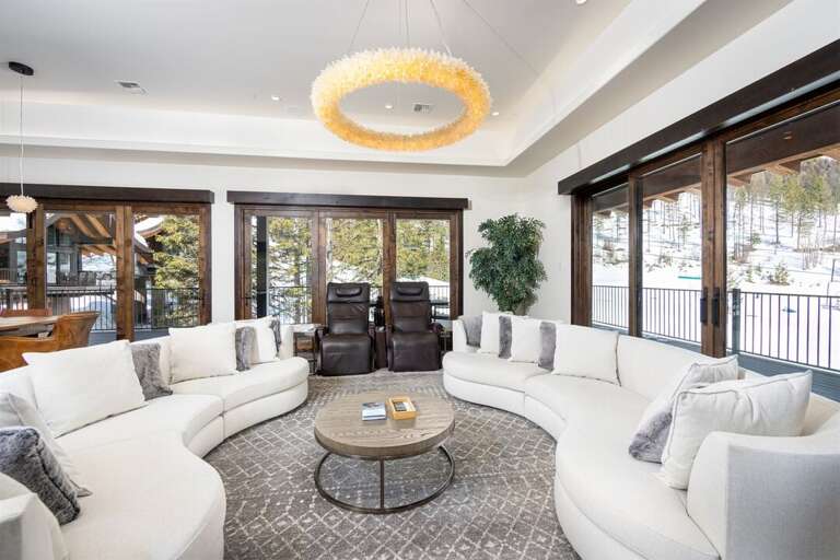This luxury, modern living room has plenty of seating for your whole group | Main Level