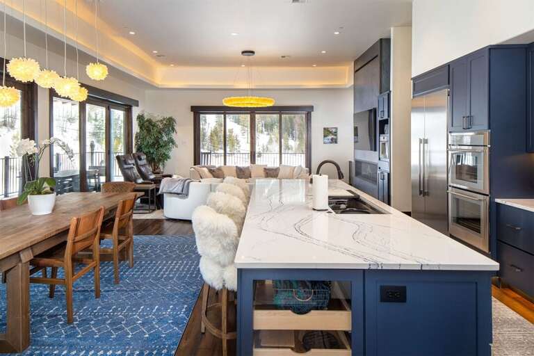 The main living space of the home features incredible custom crystal lighting | Main Level