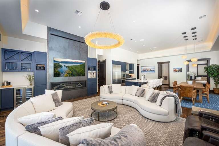 The open concept living area is embellished with custom lighting | Main Level