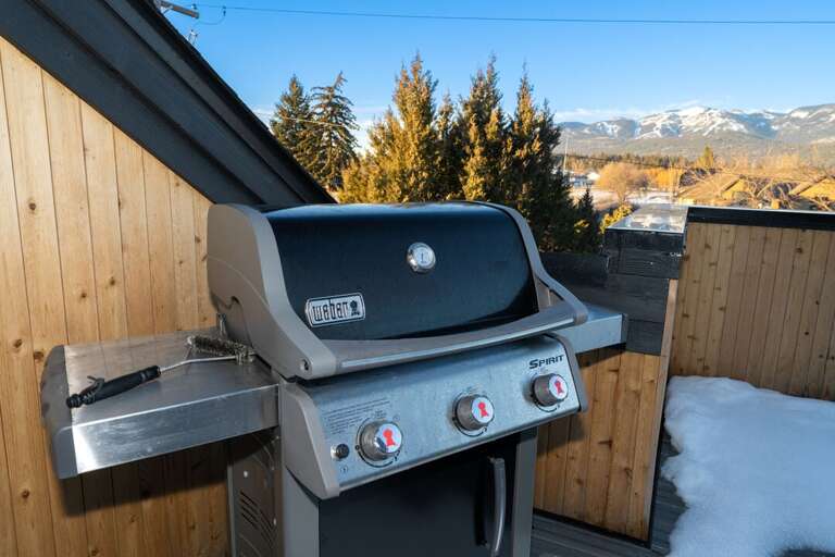 Grill On Snowy Balcony With Mountain View