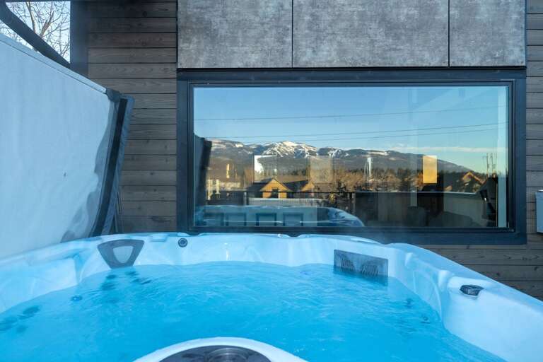 Bubbling Blue Jacuzzi With Mountain View Reflection