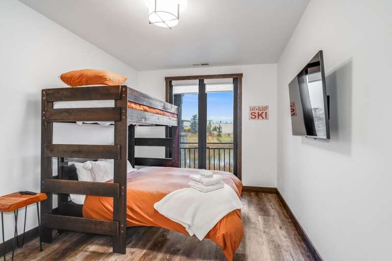 Bedroom 2 - Twin over Queen bunk bed, a 42” Smart TV | Main Level