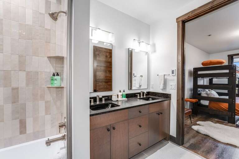 En suite bathroom with dual sink and tub/shower comboEn suite bathroom with dual sink and tub/shower combo | Main Level