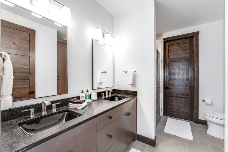 En suite bathroom with a dual sink vanity | Main Level