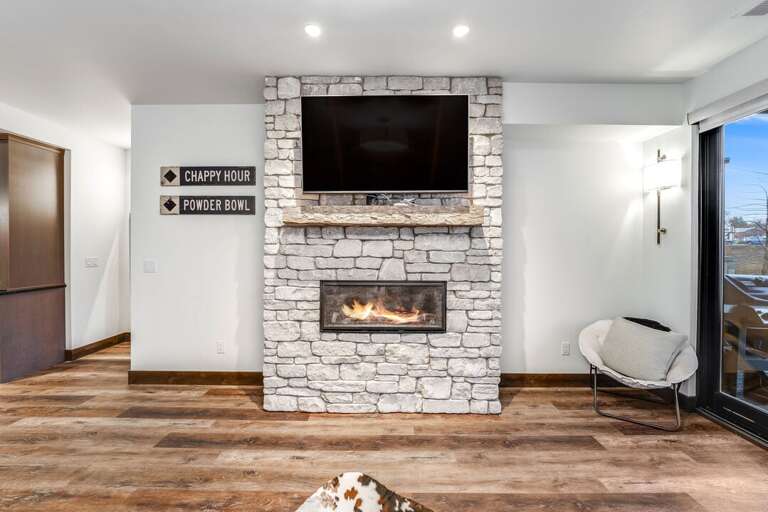 Enjoy entertainment on the 42" Smart TV or cozy up next to the gas fireplace | Main Level