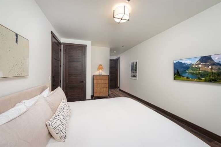 Bedroom 3 offers a king bed, an ensuite & private television | Main Level