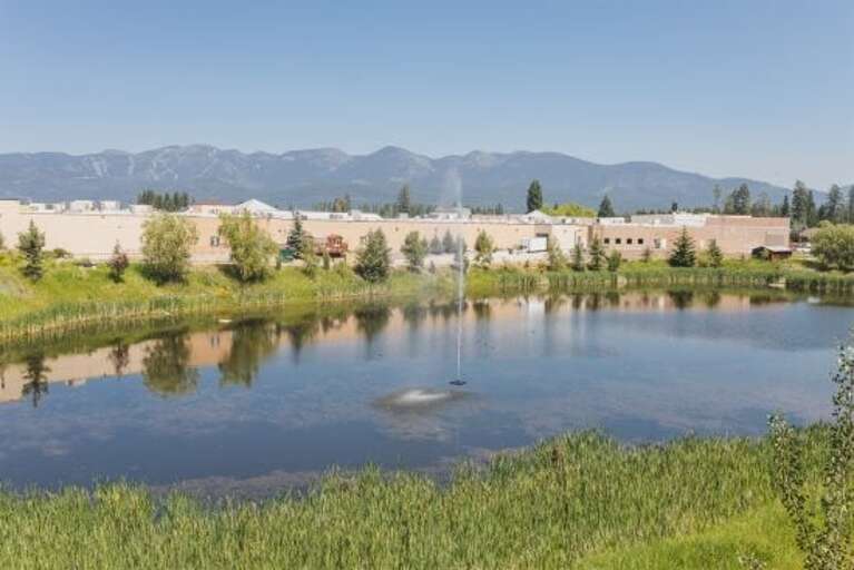 The condo offers views of Eagle Lake and access to community walking trails and fire pits | Exterior