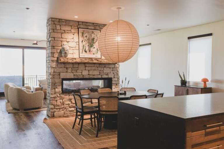 The open concept living room, dining room & kitchen provide an incredible space for your group to gather | Main Level