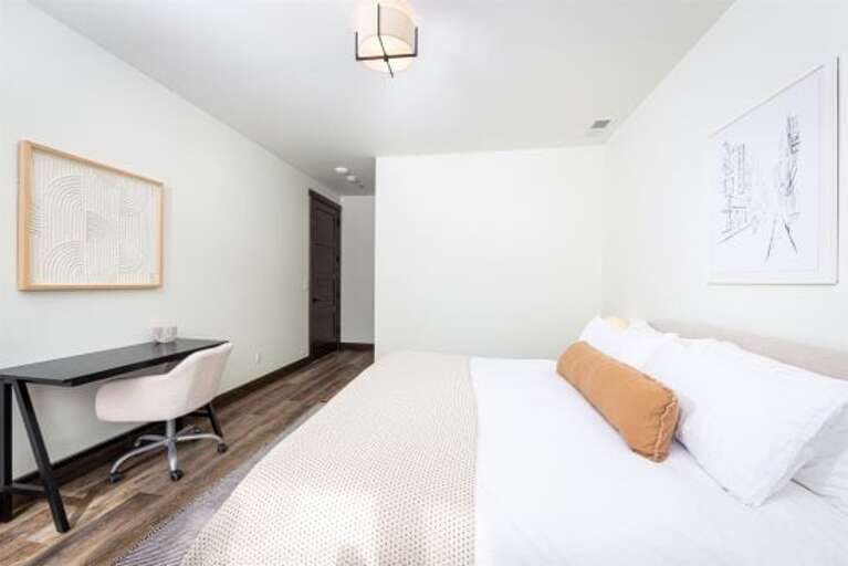 Styled with warm, modern decor, the primary bedroom is a relaxing retreat | Main Level