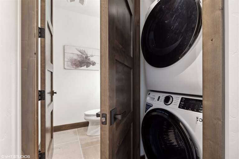 Adjacent to the main living space, the home offers an in-unit washer and dryer | Main Level