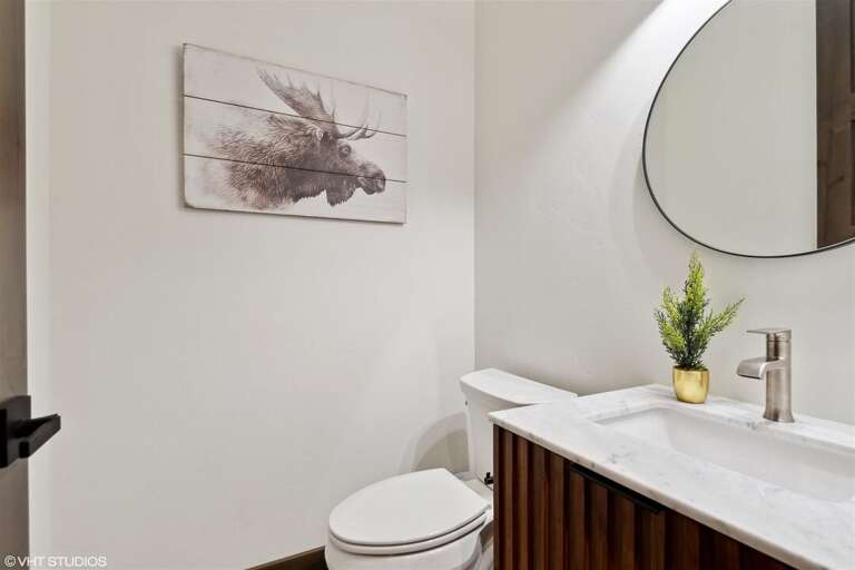 The half bath serves the main living space of the home | Main Level