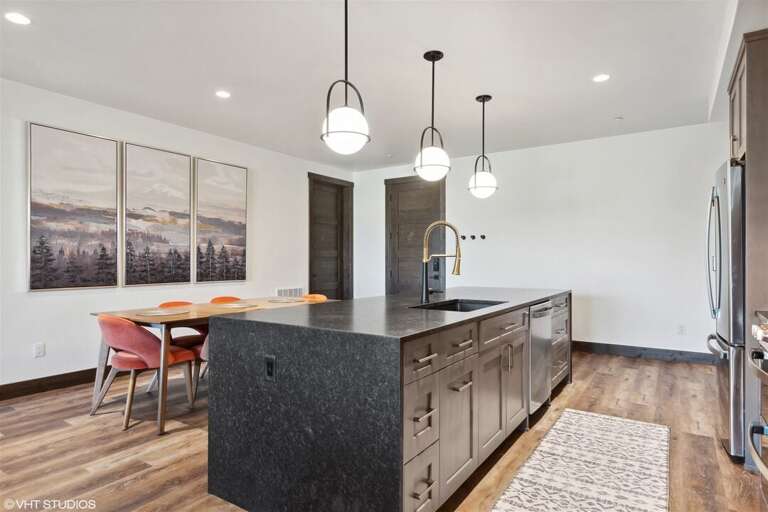 Equipped with modern fixtures and appliances, the kitchen is a chefs dream | Main Level