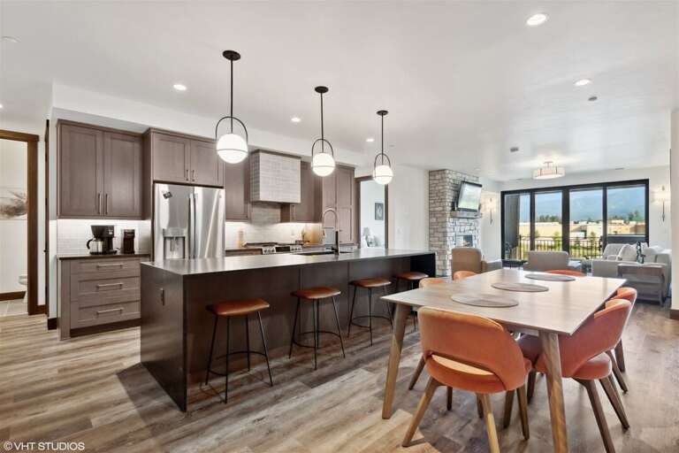 The open concept living area seamlessly integrates the living room, dining room, and kitchen | Main Level