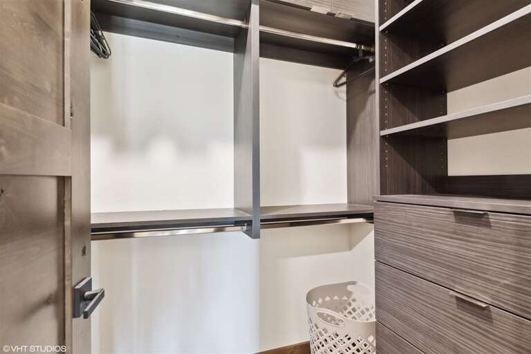 The primary suite walk-in closet offers plenty of space to unpack and settle in | Main Level