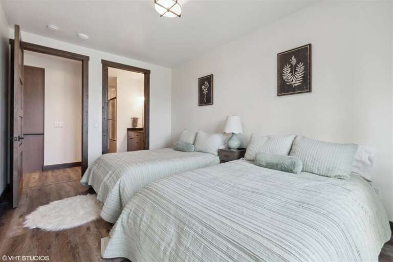 Thoughtfully decorated, the guest bedroom is a great space for visitors of all ages | Main Level