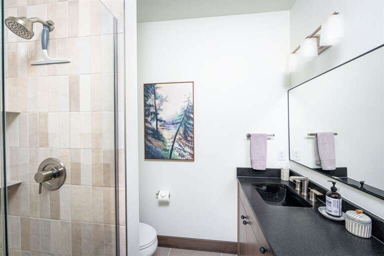 Bedroom 3 offers a spa-like ensuite with walk-in shower | Main Level