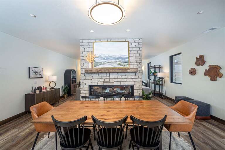 Enjoy a memorable meal beside the lovely pass through fireplace | Main Level