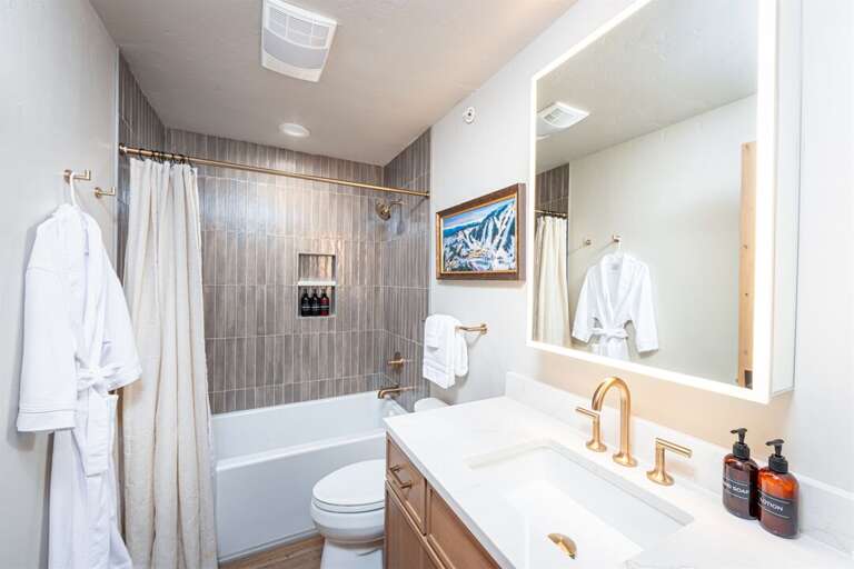 With modern fixtures and amenities, the bathroom is a spa-like retreat | Main Level