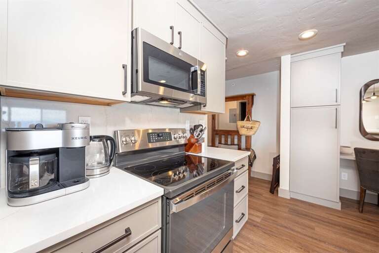 The newly renovated kitchen features high-end appliances and beautiful cabinetry | Main Level