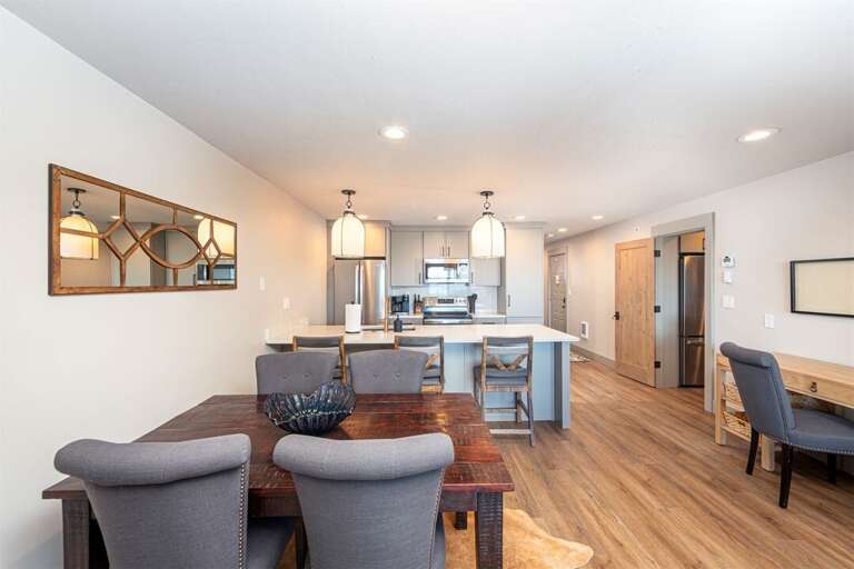 The main living space of the condo seamlessly integrates living, dining, office & kitchen spaces | Main Level