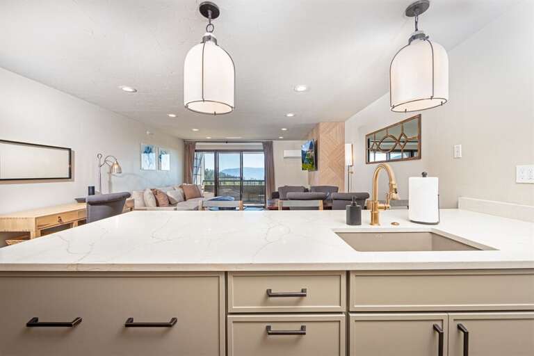 Prepare a meal while catching up on your day of adventure in this beautifully open concept condo | Main Level