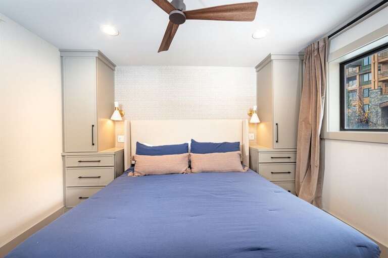 Custom cabinetry frames the king bed, providing ample space to unpack and settle in | Main Level