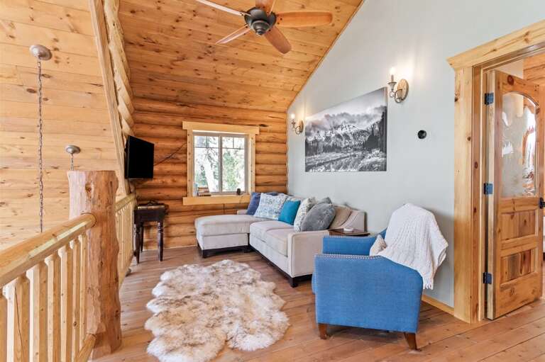 Upper level loft living space with TV