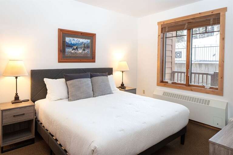 Bedroom 2 features a king bed and full bathroom with oversized shower & bathtub | Main Level