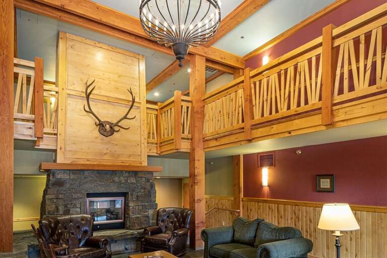 The lobby features an inviting seating area with a fireplace | Main Level Lobby