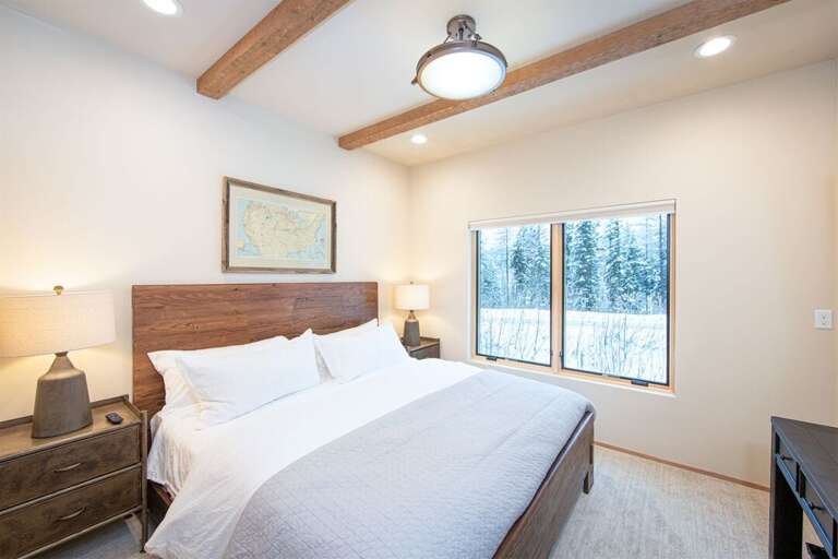 Bedroom 2 offers a king bed with a television & walk-in closet | Lower Level