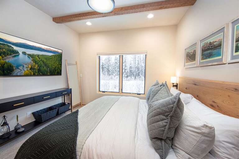 Bedroom 3 offers a king bed with a television and ample closet space | Lower Level
