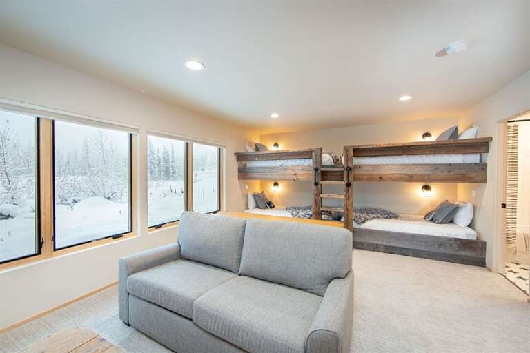 The bunk room offers 4 twin xl bunks in a beautiful barn wood frame | Basement Lowest Level