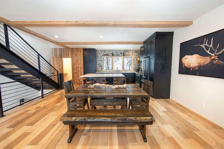 Enjoy a memorable meal together in the home's modern-rustic dining room | Middle Level