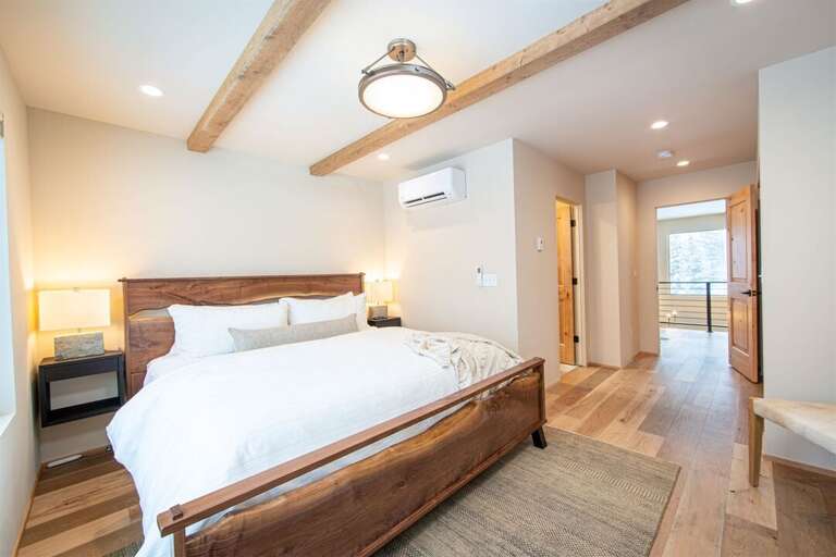 The master suite leads out to the loft overlooking the living room | Upper Level
