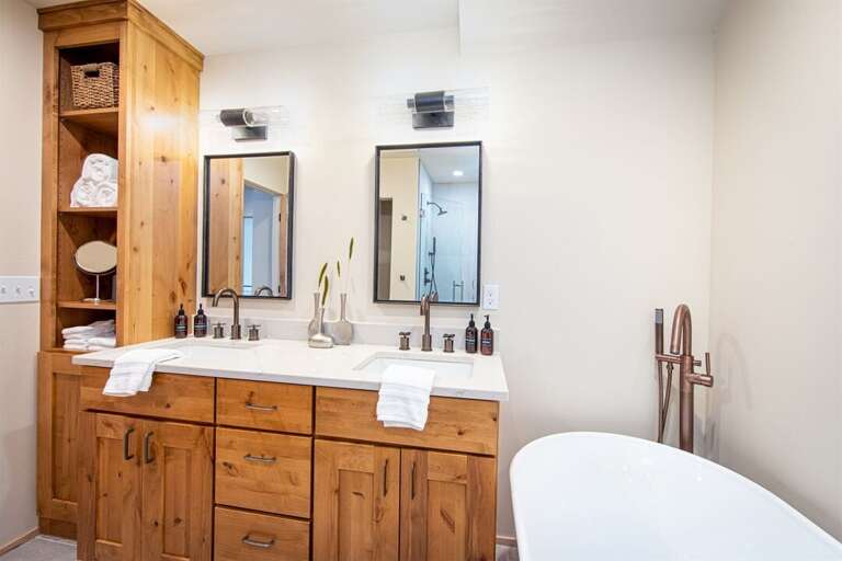 The modern luxurious master suite is a spa-like retreat | Upper Level