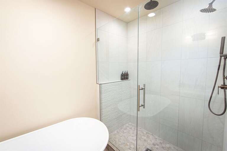 Relax and refresh in the luxurious master ensuite with custom tile shower and soaker tub | Upper Level