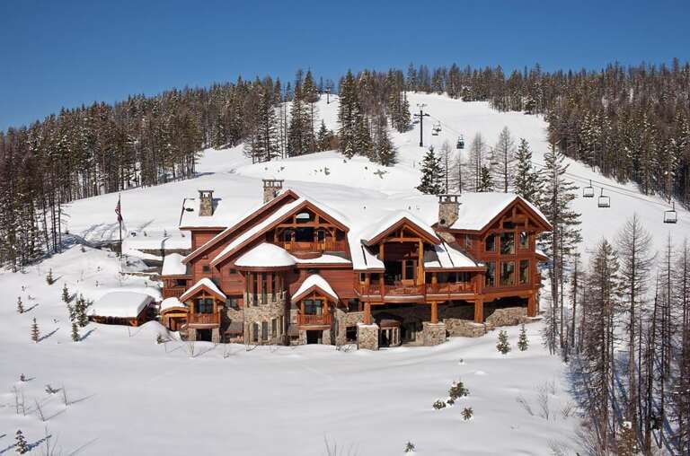 Custom architecture, woodwork & stonework make Northern Lights Lodge a one-of-a-kind luxury mountain getaway | Exterior