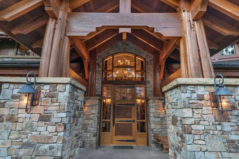 The grand architecture and style begins at the custom front door | Exterior