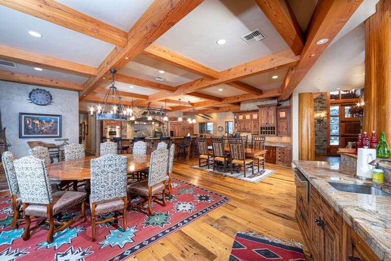 The main dining area features plenty of seating for your whole group with open views of the kitchen and great room | Main Level