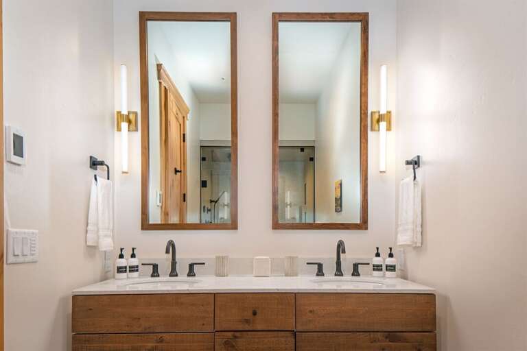 The master ensuite features a double vanity, perfect for preparing for a day of adventure | Main Level