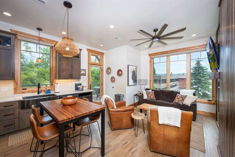 The open concept kitchen and living area are a beautifully decorated, cozy space | Main Level