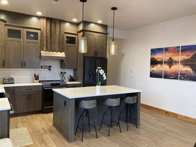 With custom features & beautiful artwork throughout, this chic downtown Whitefish condo is a great spot for your next Montana adventure | Main Level With custom features & beautiful artwork throughout, this chic downtown Whitefish condo is a great spot for your next Montana adventure | Main Level