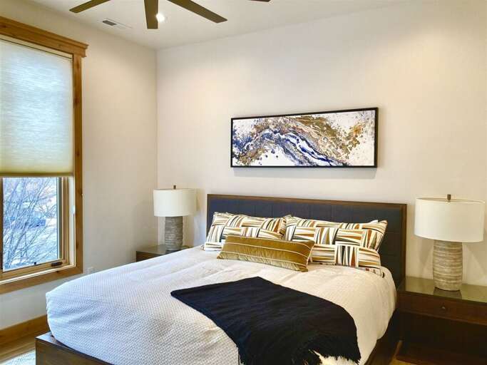 The master bedroom offers a modern aesthetic in a comfortable, functional space | Main Level The master bedroom offers a modern aesthetic in a comfortable, functional space | Main Level