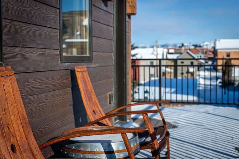 The whiskey barrel-inspired patio set provides a comfortable place to take in the incredible mountain views | Exterior The whiskey barrel-inspired patio set provides a comfortable place to take in the incredible mountain views | Exterior