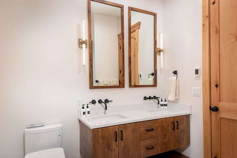 The bathrooms feature stylish modern vanities, heated floors & electronic heated toilets | Main Level