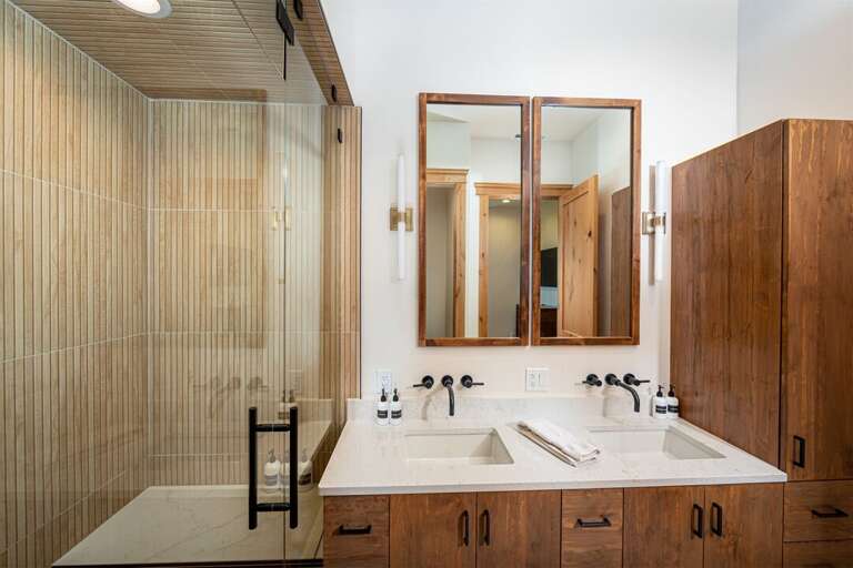 With a double sink vanity and walk in steam shower, Obrien Penthouse unit 301 is pure luxury | Main Level
