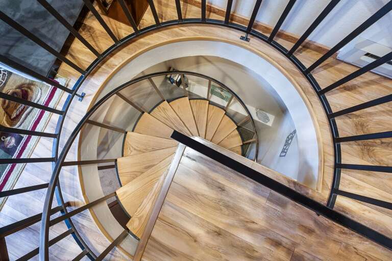 Spiral staircase leading to the bedrooms downstairs | Interior
