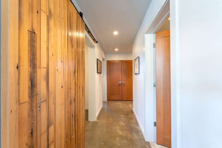 Hallway leading from the bedrooms to the ski room | Lower Level