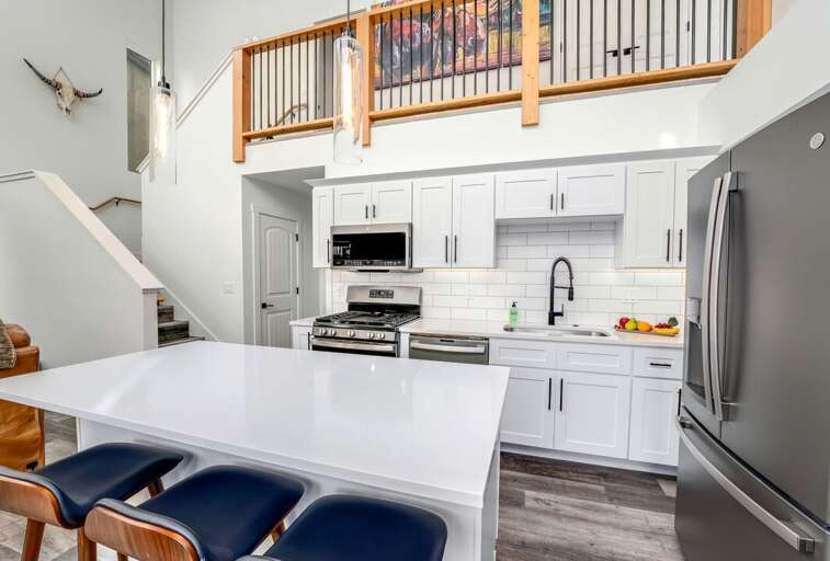 Spacious countertops, Center island with seating for three | Main Level